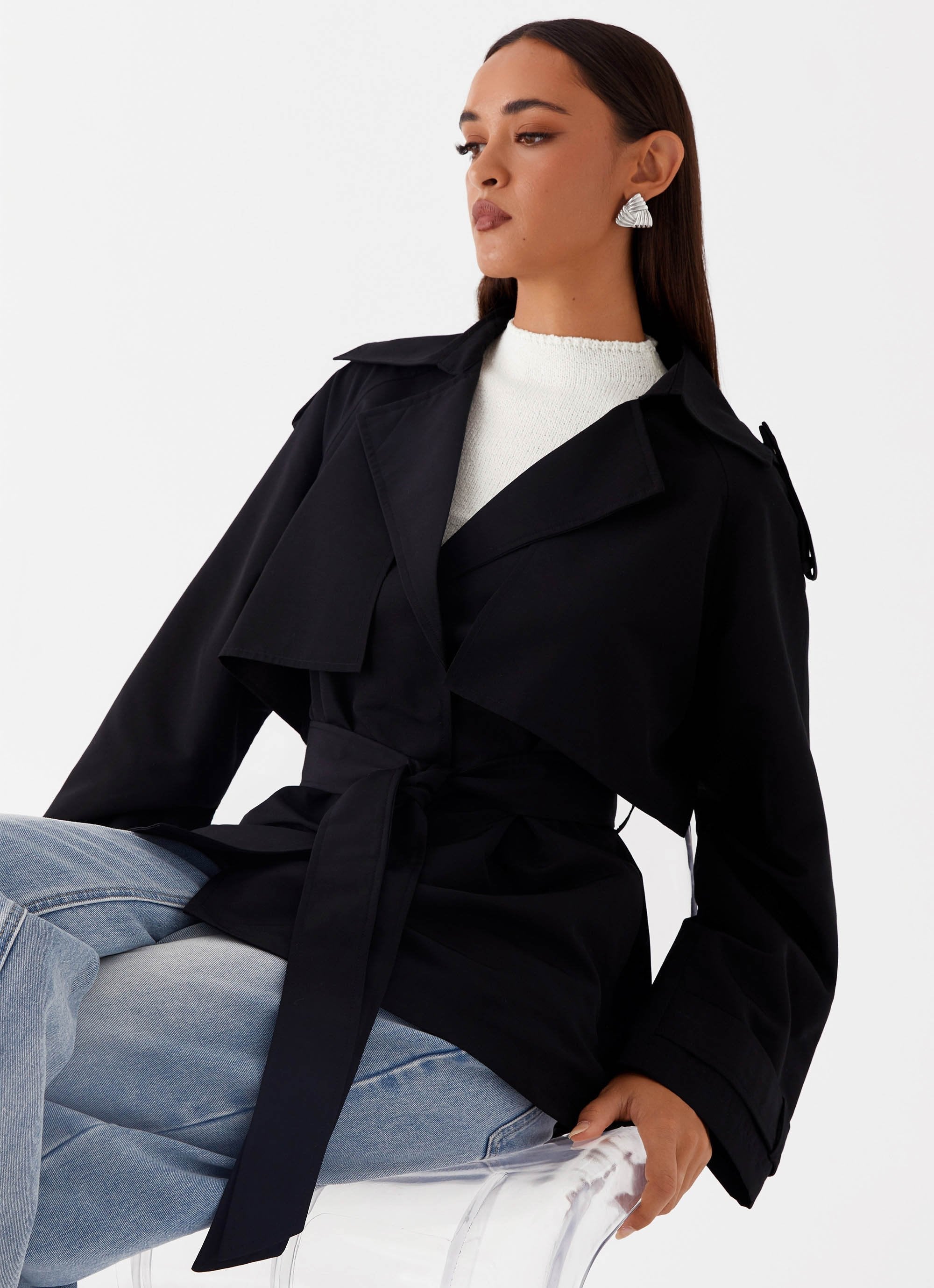Women's black short trench coat outfit