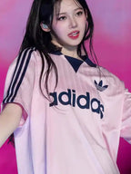 babymonster-rora-adidas-collared-goalie-pink-top